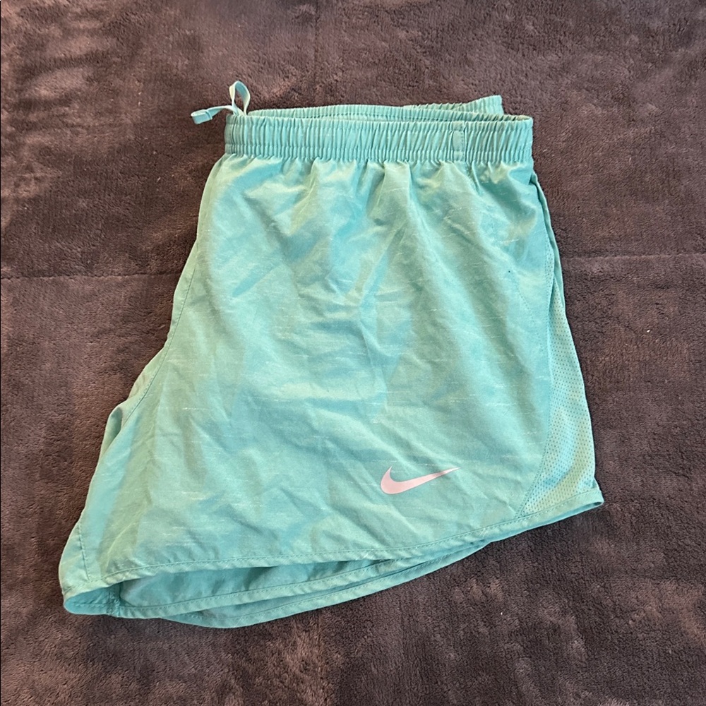 Nike Women's Mint Green Athletic Shorts with Pink Swoosh